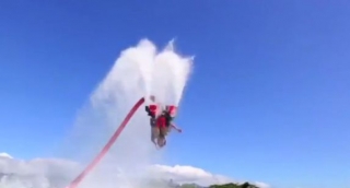  Man doing a somersault with the Fly Board 